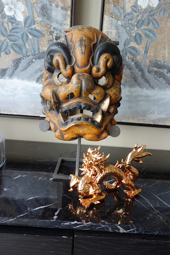 This mask was purchased years ago while I was shooting a story in Ojai California. The ceramic dragon is from a souvenir store in New York City.