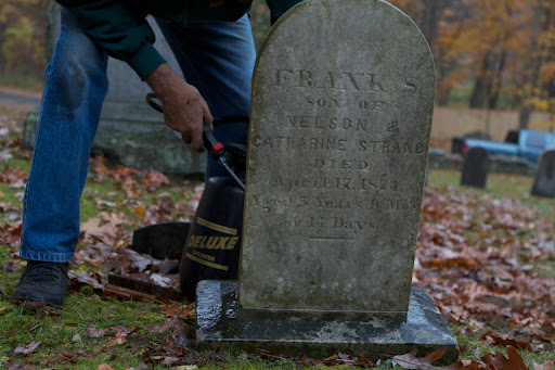 That day, the group cleaned several of the head stones, which become discolored over time with mold, mildew, lichen, moss, and acid rain.