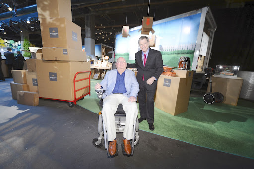 Designer Michael Graves and Mike Ullman, CEO of jcpenney, pose for a photo in front of Michael's vignette.