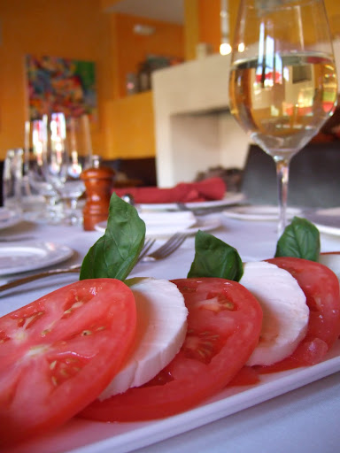 I add a few of my favorite 'essence of summer' dishes to the menu during the season. One, of course, is the classic Caprese salad, with our own mozzarella, local tomatoes, and basil grown in the garden behind the restaurant.