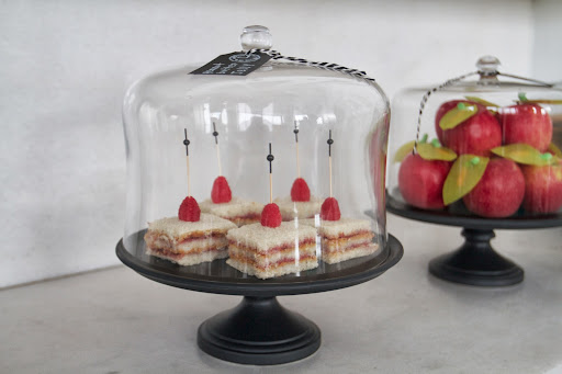 Back to School: PB & J sandwiches topped with raspberry skewers in black ceramic cake stand with dome (Martha Stewart Collection at Macy's, $80)