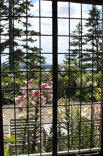 The view off the terrace from inside the house displays both the water and thriving terrace garden.