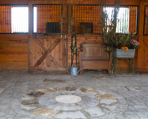 The round design of the floor was an inspiration after the owner traded the round millstone for some other artifact.
