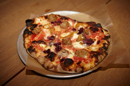 Pizza with sausage and onions