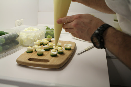 Pierre perches the eggs atop a seedless cucumber slice with a bit of the filling between the egg and the cucumber.