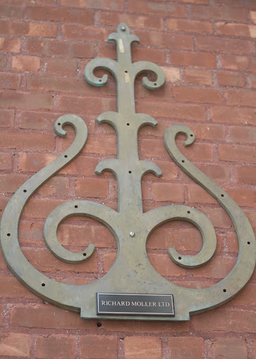 Richard chose this bronze casting of the eternal flame for his company logo. He feels it aptly represents what he's trying to do with his furniture restoration - keeping vanishing techniques from fading away.
