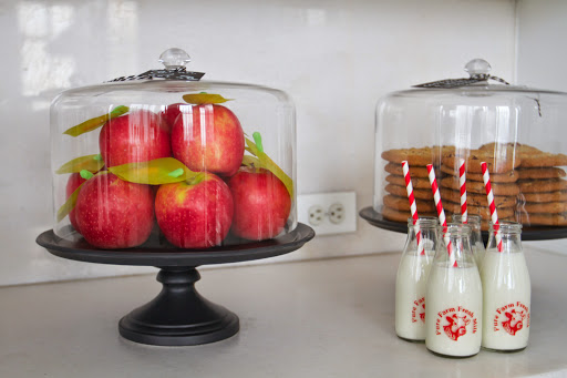 Back to School: Pink lady apples with handcrafted leaf and caterpillar decorations in black ceramic cake stand & dome (Martha Stewart Collection at Macy's), mini milk bottles with farm fresh milk