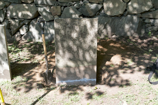 In the far corner of Lounsbery Cemetery, another headstone had been broken off below the soil line. Will dug down, exposing the base, which is typically 1/3 of the exposed stone deep. Epoxy joined the two pieces back together.
