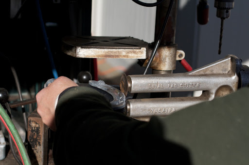There's a very specific tool for this purpose called a pad cutter.