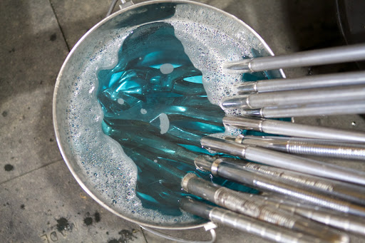 PJ Murphey, an equine dentist, is one of a select few in the U.S. trained to perform this type of tooth extraction. He and Elizabeth spoke strategy and then he sterilized his tools for the operation.
