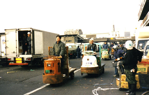 In 2000, I traveled to Tokyo and toured Tsukiji Market with Nobu. It is a bustling place in the wee hours of the morning. Turret trucks, like these, zip around the market transporting goods.