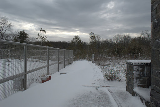 We exited through the headhouse at the rear. The fence surrounds the vegetable garden. The eastern horizon was still very stormy looking.
