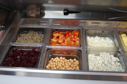Ingredients for those salads are fresh, vibrant, and within easy reach for the prep person.