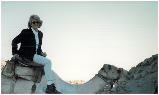 This book got me thinking of my visit to Egypt in 1996 with some friends and my nieces and nephews. Here I am riding through the Saqqara Desert on a camel.