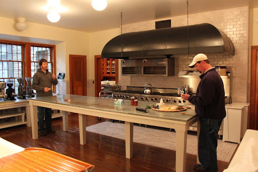 More of the Skylands crew - Mike and Blake Hodgkins are preparing to move the kitchen table off the floor so that it can be refinished.