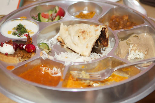 Junoon prepared delicious food. http://junoonnyc.com/ Each guest was served a sectioned platter like this, containing Paneer Mirchi Ka Salan, Chana Pindi, Nadru Kofta, Daa Makhani, Mint Raita, Kachumber Salad, Plain Naan, and Pulao Rice. Dessert was a Pumpkin Tart.
