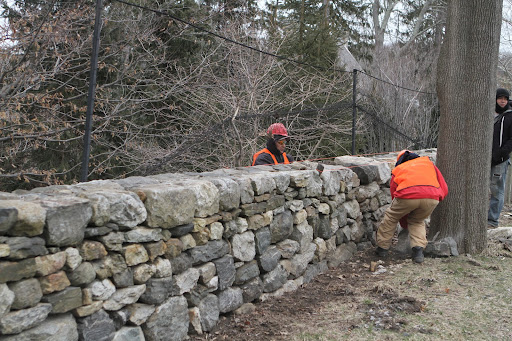 Dry stone walls and structures are stable because of their artful construction of a strong, load-bearing façade of carefully selected interlocking stones.