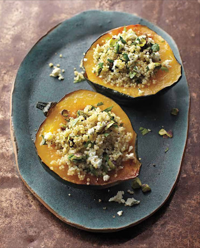 Stuffed Acorn Squash with Quinoa and Pistachios - A stuffing of quinoa, pistachios, and feta cheese elevates acorn squash from side dish to main course. For a vegan version, omit the feta and season the stuffing with one to two tablespoons nutritional yeast for a cheese flavor.