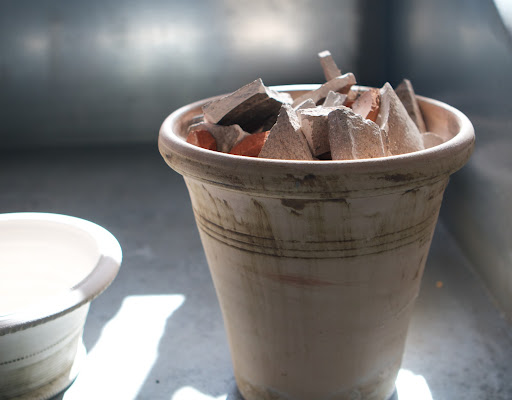 Occasionally, and quite sadly, a pot or two will fall over and break, but the pieces of those pots are saved for potting purposes.