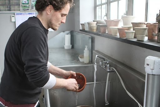 He then scrubs the pots with a very mild bleach solution - 9 parts water to 1 part bleach - This will kill any disease organisms that may be present.