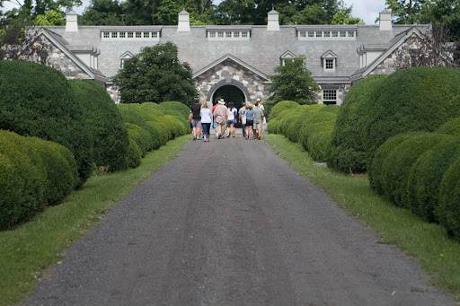 After walking through the main greenhouse and the cutting garden, the group proceeded through the allee of boxwood towards the stable.