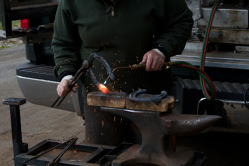 When she's certain that the shoe fits perfectly, Linda begins turning it into a winter shoe by welding borium onto the bottom.
