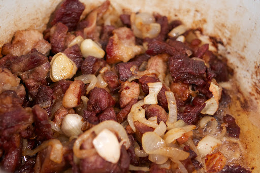 Pierre browned all of the lamb trimmings with onion and then added water to make a rich lamb stock for a demi-glace.