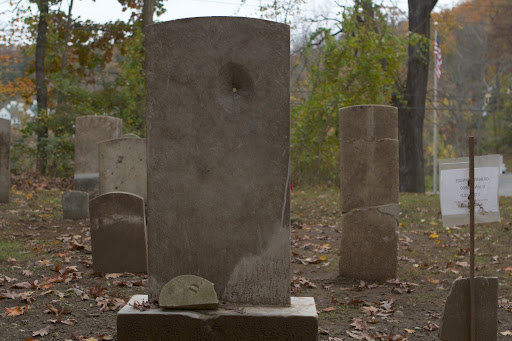 This headstone was actually shot at and has a hole clear through!