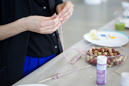 Nissa Eberly - Associate Production Director chose the pink yarn to compliment her 'Rose Chrome' and 'Light Gold' metallic finished beads.