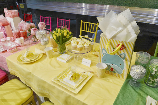 The MarthaCelebrations product line includes color-coordinated candy, balloons, cupcake liners, garlands, tableware, hanging décor, place cards, placemats, centerpiece, gift bags/wrap in 10 different color-ways.