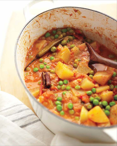 Pea and Potato Curry - This Indian stew, known as aloo matar, can be made using fresh or frozen peas. The recipe calls for fresh curry leaves, which are not related to curry powder. They can be found at Indian or Southeast Asian markets and from online retailers.