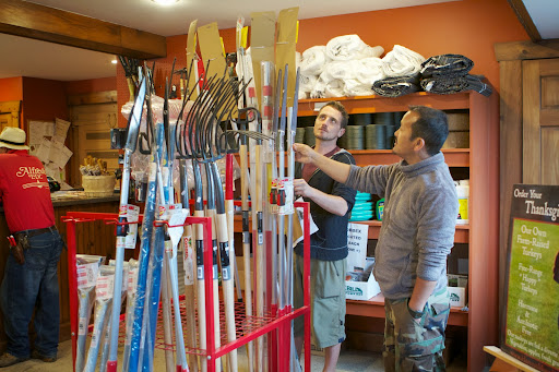 When picking up an order, you must first check in with the office. While waiting their turn, Ryan and Chhiring looked at some tools available for purchase.