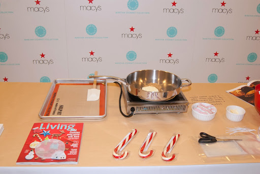 To make the popcorn balls, we melted butter and light brown sugar. Then, we added marshmallows to make the sticky mixture to coat the popped corn.