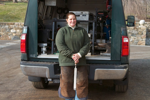 Linda works out of the back of her truck, which contains her tools, anvil, forge, or high-heat oven, and welding supplies.