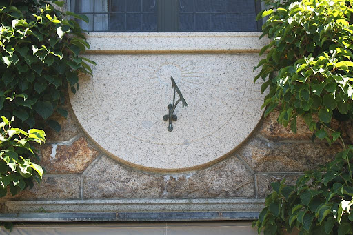 Above them is the amazing sundial which is marked 1925 AD.