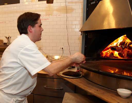The pizza chef busy at work
