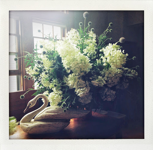 Kevin made this spectacular hydrangea and thistle arrangement for the dessert table. There are lots of old decoys in the carriage house which we use for table decorations.