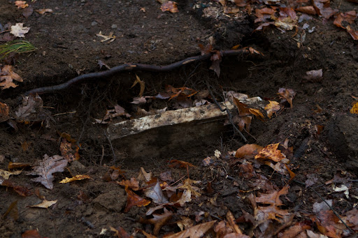 With a little digging, the rest of the headstone was uncovered.