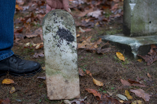 Her footstone also needs to be repositioned. Footstones are often toppled by landscaping crews.