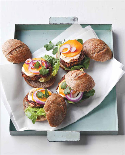 Bean-and-Vegetable Sliders are mini veggie burgers that take their cue from the flavors of Vietnamese banh mi sandwiches, with carrot, broccoli, ginger, garlic, and cilantro added to the patties and chile-spiked mayonnaise and mango used as toppings.