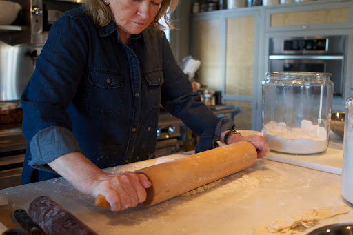 For rolling out pie crust, I really love this large and heavy maple rolling pin. It saves a lot of arm and back muscle!