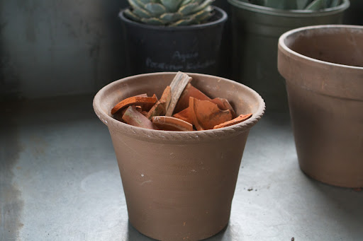 Unfortunately, flowerpots break from time to time and those pots are further broken into shards for repotting purposes.