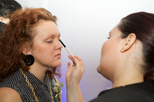 Around the perimeter of the party, various cosmetic vendors were on hand, offering free make-over sampling.