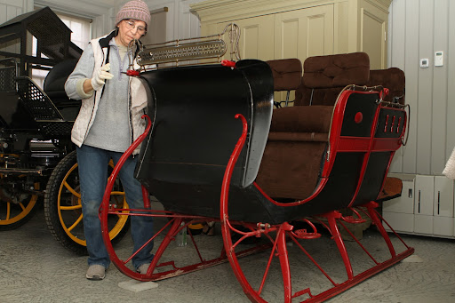 This is my housekeeper, Laura Acuna, polishing my horse drawn sleigh. This one dates from the early 1900s. Laura and Sanu worked hard getting the carriage house ready for the tour.