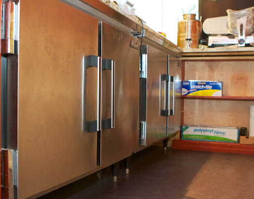 The marble sits right on top of two refrigerators, which do a fine job of keeping the stone quite cold, and the cheeses quite cool.