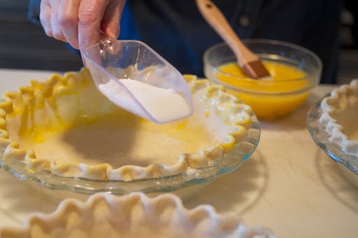 I then coat the egg wash with a little sprinkling of sugar.