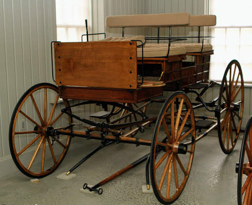 This is a Brewster Bronson Wagon, also from 1900, which was the popular sporting wagon for country gentlemen. It's framed and paneled sides were the inspiration for the early