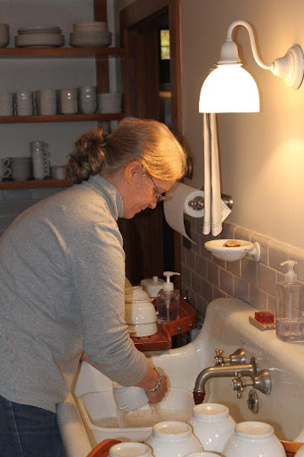 All that China is taken down and washed each spring. This is one of the housekeepers, Gretchen Sweet, busy at work.