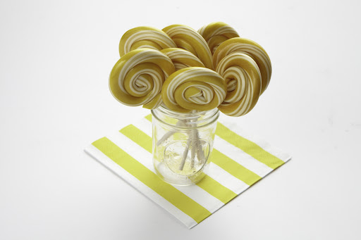 Mason jars can also be used to hold candy, like these lollipops.