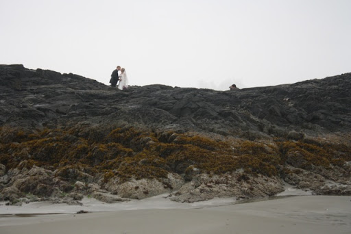 It was raining when we arrived, but we donned some rain gear and went out to explore the beach. Look what we came across! Newlyweds! And a kiss in the rain captured by the almost-hidden photographer.